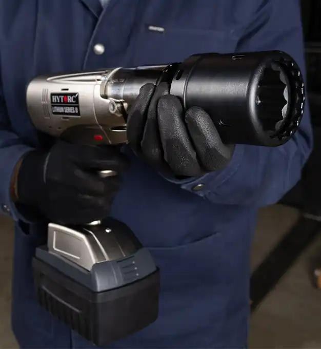A technician holding a HYTORC Lithium Series II electric torque tool