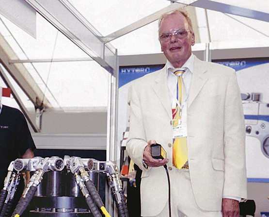 An image of John Junkers, founder of HYTORC, demonstrating Simultorc technology.