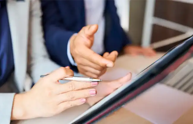 Two professionals reviewing a quote together